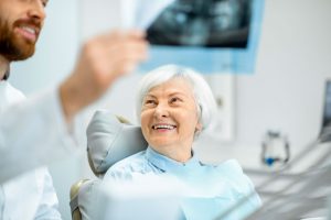 An Elderly Lady Receives Dentures Service in Burlington, ON
