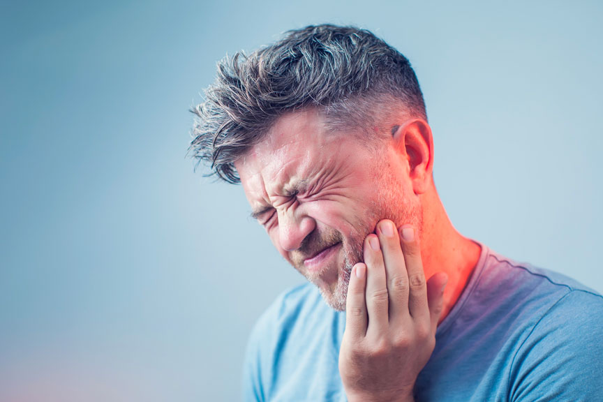 A Man Suffering from Jaw Pain & Needs TMJ Treatment in Burlington