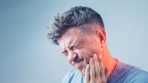 A Man With Severe Teeth Pain