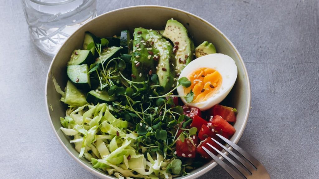 Healthy Bowl With Avocado Vegetables And Boiled Egg
